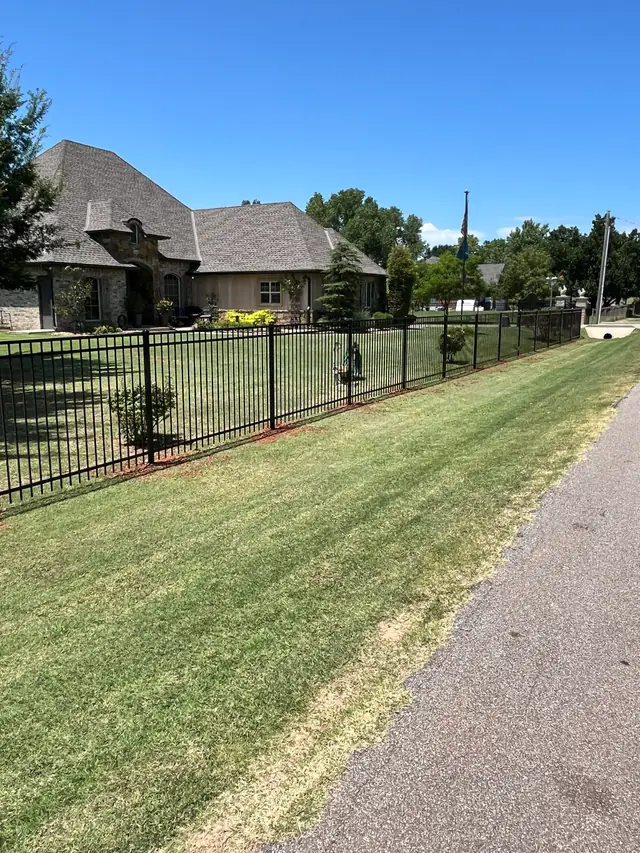 Estate-scale black wrought iron perimeter fence built by Fence Masters in Oklahoma City